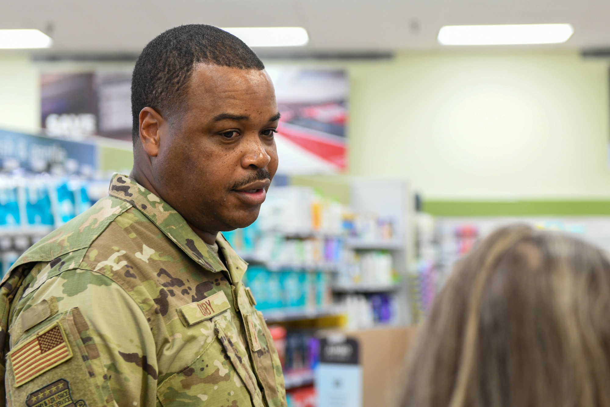 Chief Master Sgt. Kevin Osby, senior enlisted advisor for the Army and Air Force Exchange Service, tours the Exchange at Altus Air Force Base, Oklahoma, August 3, 2022. The exchange has 18 employees, including civilians, retirees and veterans. (U.S. Air Force photo by Airman 1st Class Trenton Jancze)