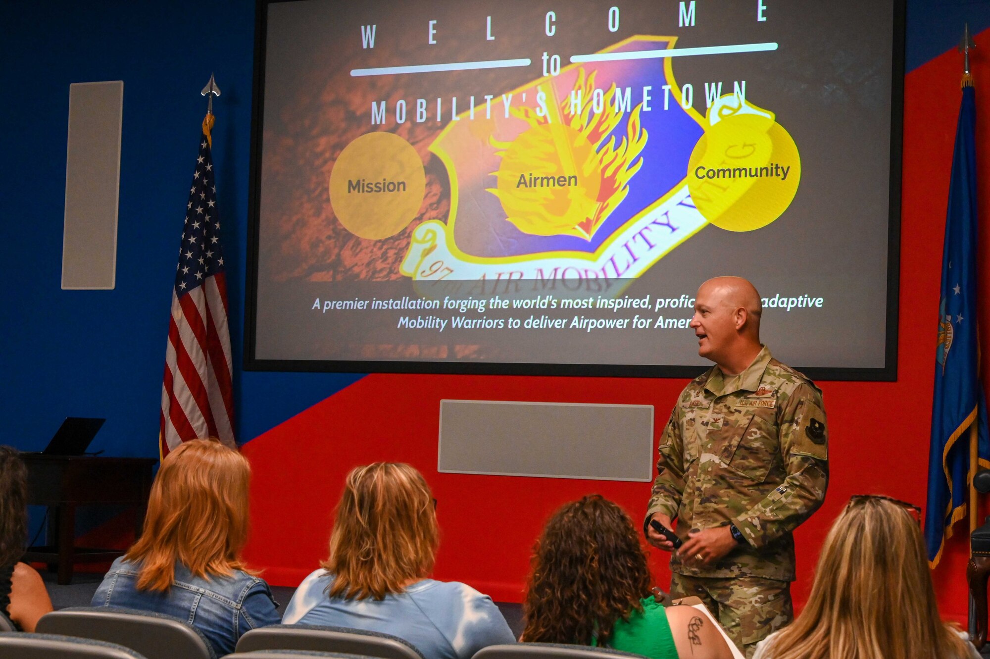 U.S. Air Force Col. Blaine Baker, 97th Air Mobility Wing commander, talks with local teachers during a tour at Altus Air Force Base (AAFB), Oklahoma, Aug. 2, 2022. Baker spoke about AAFB’s mission, Airmen and community partnership within Altus. (U.S. Air Force photo Senior Airman Kayla Christenson)