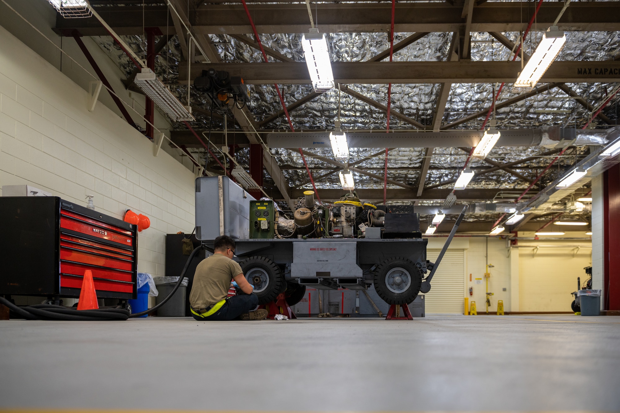 Airman inspecting equipment