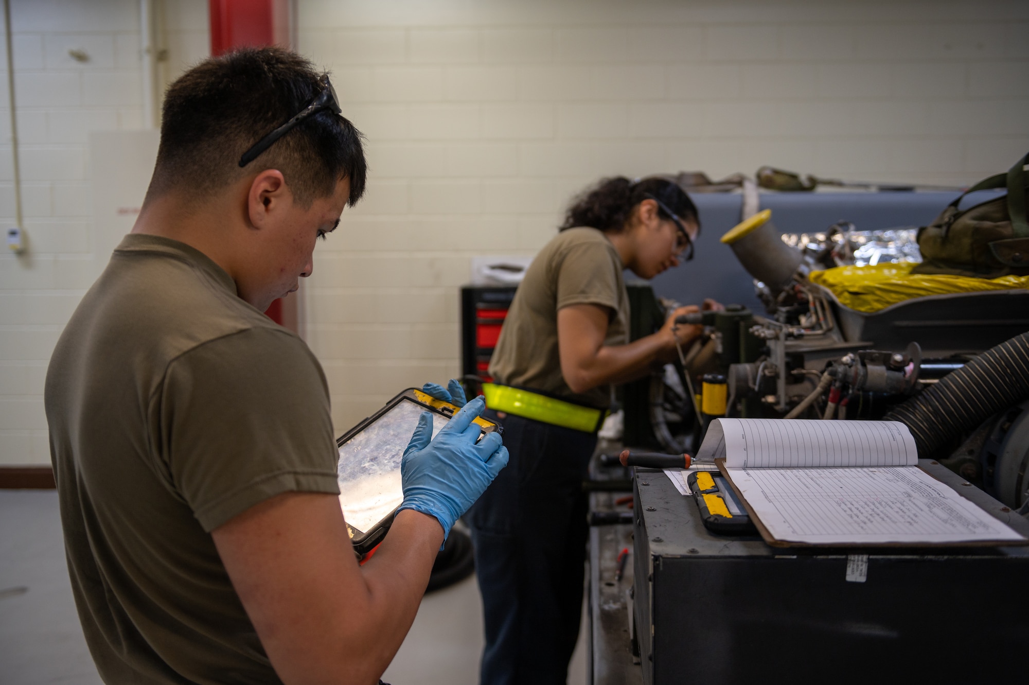 Airman inspecting equipment