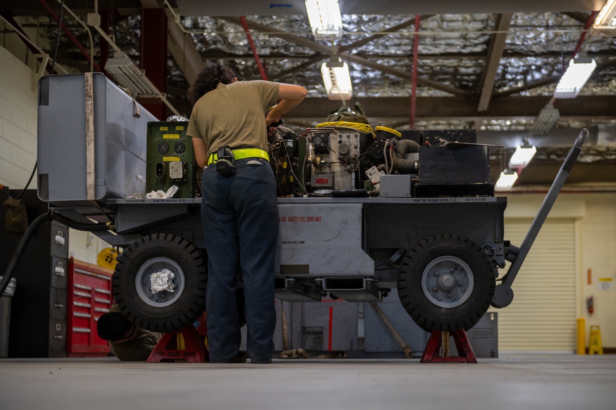 Airman inspecting equipment