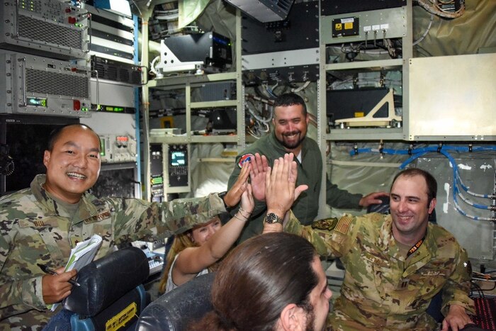 Project 212 team celebrate following the in-flight demonstration of STITCHES and Missionware