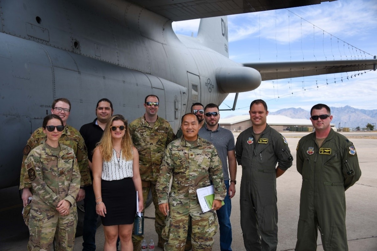Project 212 Team stand outside the EC-130H Compass Call
