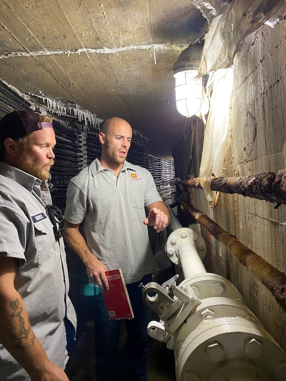 Mechanics replace old, rusted pipes for hydraulics system