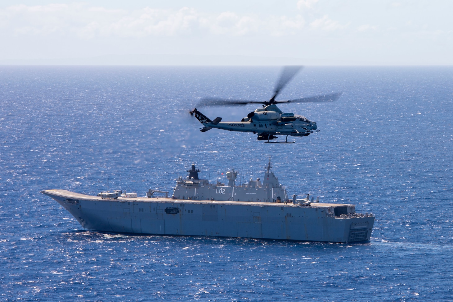 PACIFIC OCEAN (Aug. 1, 2022) An AH-1Z Viper, attached to Marine Light Attack Helicopter Squadron (HMLA) 169, conducts flight operations with Royal Australian Navy Canberra-class landing helicopter dock HMAS Canberra (L02), during Rim of the Pacific (RIMPAC) 2022, Aug. 1. Twenty-six nations, 38 ships, three submarines, more than 170 aircraft and 25,000 personnel are participating in RIMPAC from June 29 to Aug. 4 in and around the Hawaiian Islands and Southern California. The world's largest international maritime exercise, RIMPAC provides a unique training opportunity while fostering and sustaining cooperative relationships among participants critical to ensuring the safety of sea lanes and security on the world's oceans. RIMPAC 2022 is the 28th exercise in the series that began in 1971. (U.S. Navy photo by Mass Communication Specialist 3rd Class Isaak Martinez)