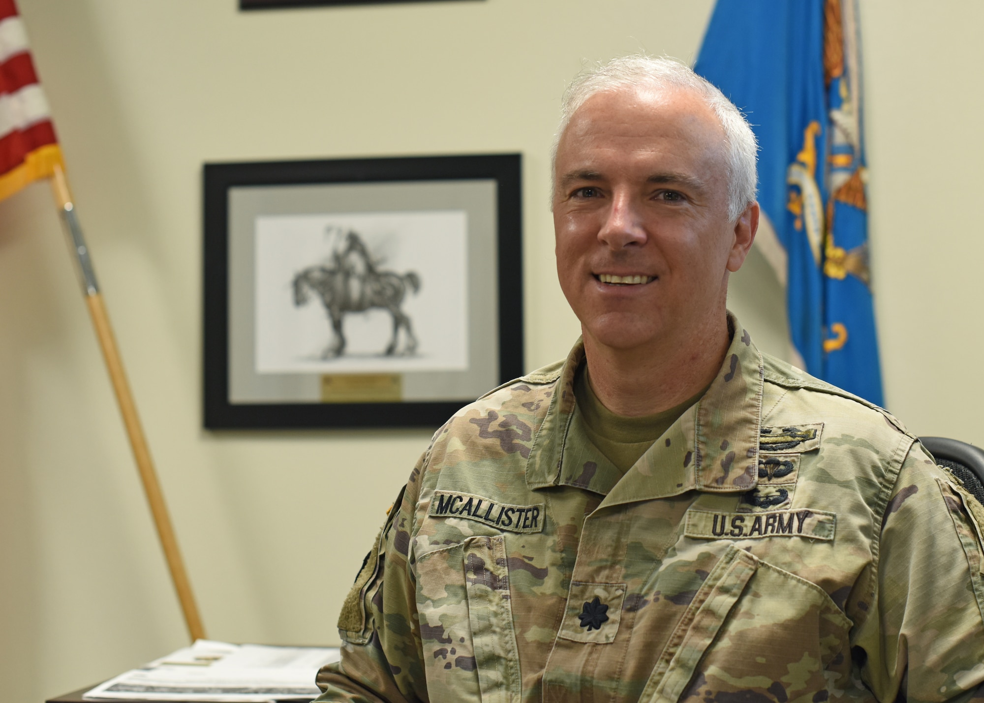 U.S. Army Lt. Col. John McAllister, 344th Military Intelligence Battalion commander, poses for a photo at his desk, Goodfellow Air Force Base, Texas, August 2, 2022. McAllister assumed command of the 344th MI BN on June 21. (U.S. Air Force photo by Airman 1st Class Zachary Heimbuch)