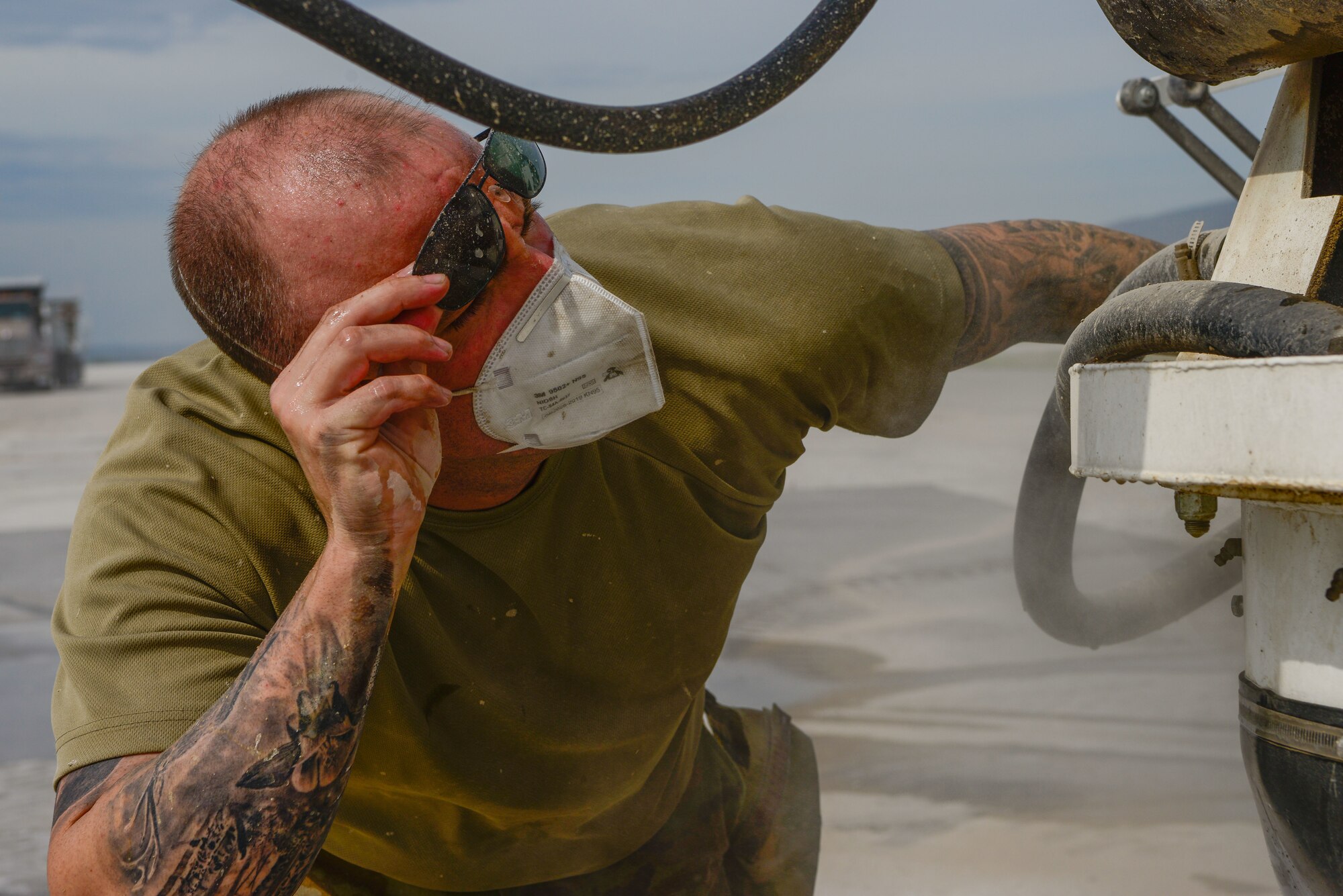 U.S. Air Force Staff Sgt. Jacob Martin, 31st Civil Engineer Squadron pavements and heavy equipment operator journeyman, inspects a concrete truck at Aviano Air Base, Italy, July 27, 2022. As a member of the 31st CES’s “Dirt Boyz” section, Martin is responsible for any CE project that involves construction and repair on runways, roads, sidewalks and more. (U.S. Air Force photo by Airman 1st Class Thomas Calopedis)