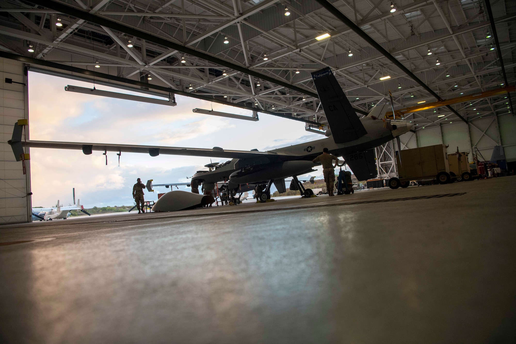 MARINE CORPS AIR STATION, KANEOHE BAY, Hawaii (July 25, 2022) U.S. Air Force Airmen conduct maintenance on an MQ-9 Reaper assigned to the 163rd Wing at March Air Reserve Base, Calif., during Rim of the Pacific (RIMPAC) 2022, July 25, at Marine Corps Air Station Kaneohe Bay, Hawaii.