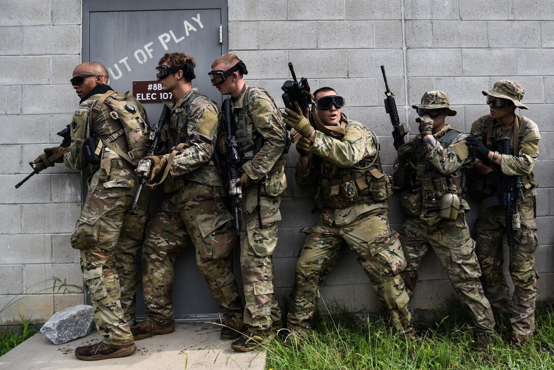 U.S. Army National Guard Soldiers conquer the culminating training event on the way to earning the 11B Infantryman military occupational speciality July 27, 2022, at Fort Picket, Virginia. The Soldiers repeatedly worked their way through an urban training site using dry fire before donning protective gear and utilizing simulation rounds against opposing forces as they secured the site. The exercise was part of the three-week 11B Infantry Transition Course, taught by cadre assigned to the 183rd Regiment, Regional Training Institute. The course brought together more than 20 Soldiers from across the nation to learn basic infantry skills at the junior Soldier and noncommissioned officer level. (U.S. Army National Guard photo by Sgt. 1st Class Terra C. Gatti)