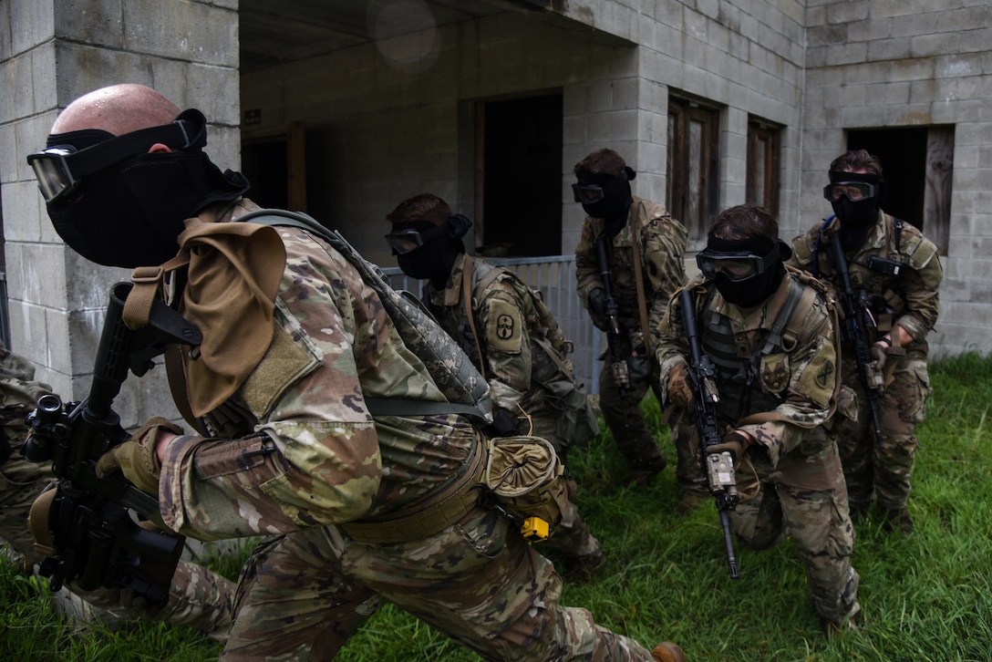 U.S. Army National Guard Soldiers conquer the culminating training event on the way to earning the 11B Infantryman military occupational speciality July 27, 2022, at Fort Picket, Virginia. The Soldiers repeatedly worked their way through an urban training site using dry fire before donning protective gear and utilizing simulation rounds against opposing forces as they secured the site. The exercise was part of the three-week 11B Infantry Transition Course, taught by cadre assigned to the 183rd Regiment, Regional Training Institute. The course brought together more than 20 Soldiers from across the nation to learn basic infantry skills at the junior Soldier and noncommissioned officer level. (U.S. Army National Guard photo by Sgt. 1st Class Terra C. Gatti)