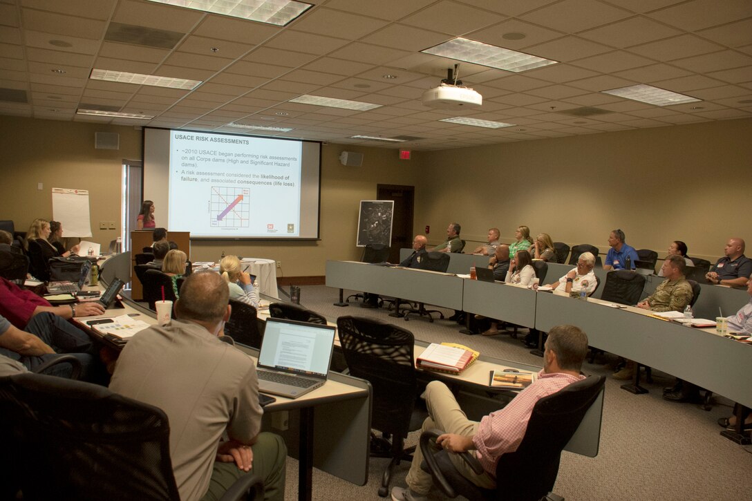 Lucia Wimberly, the dam safety program manager for the U.S. Army Corps of Engineers, Savannah District, provides an overview of the Corps Dam Safety Program during a tabletop exercise for Clemson Diversion Dams July 27.  The exercises help foster dialogue between the Corps and stakeholders and prepares them to respond more effectively and efficiently to a dam-related emergency.