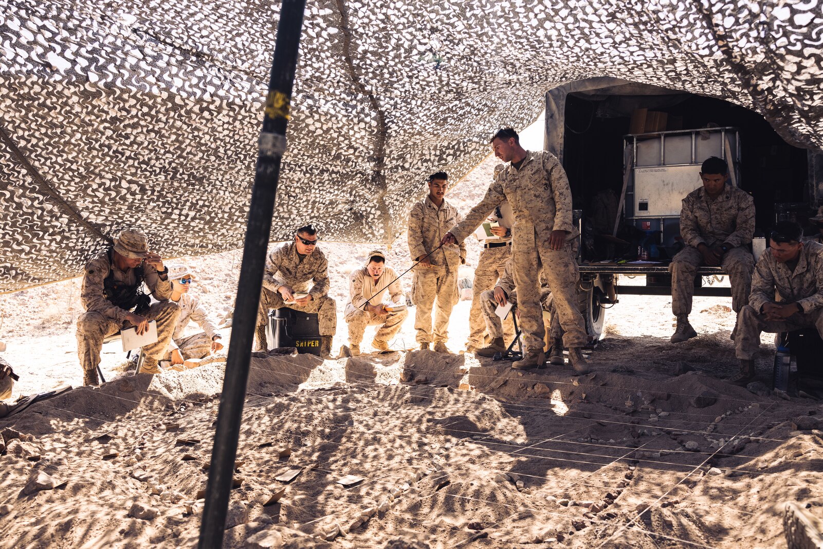 U.S. Marine Corps  chief scout sniper briefs his team