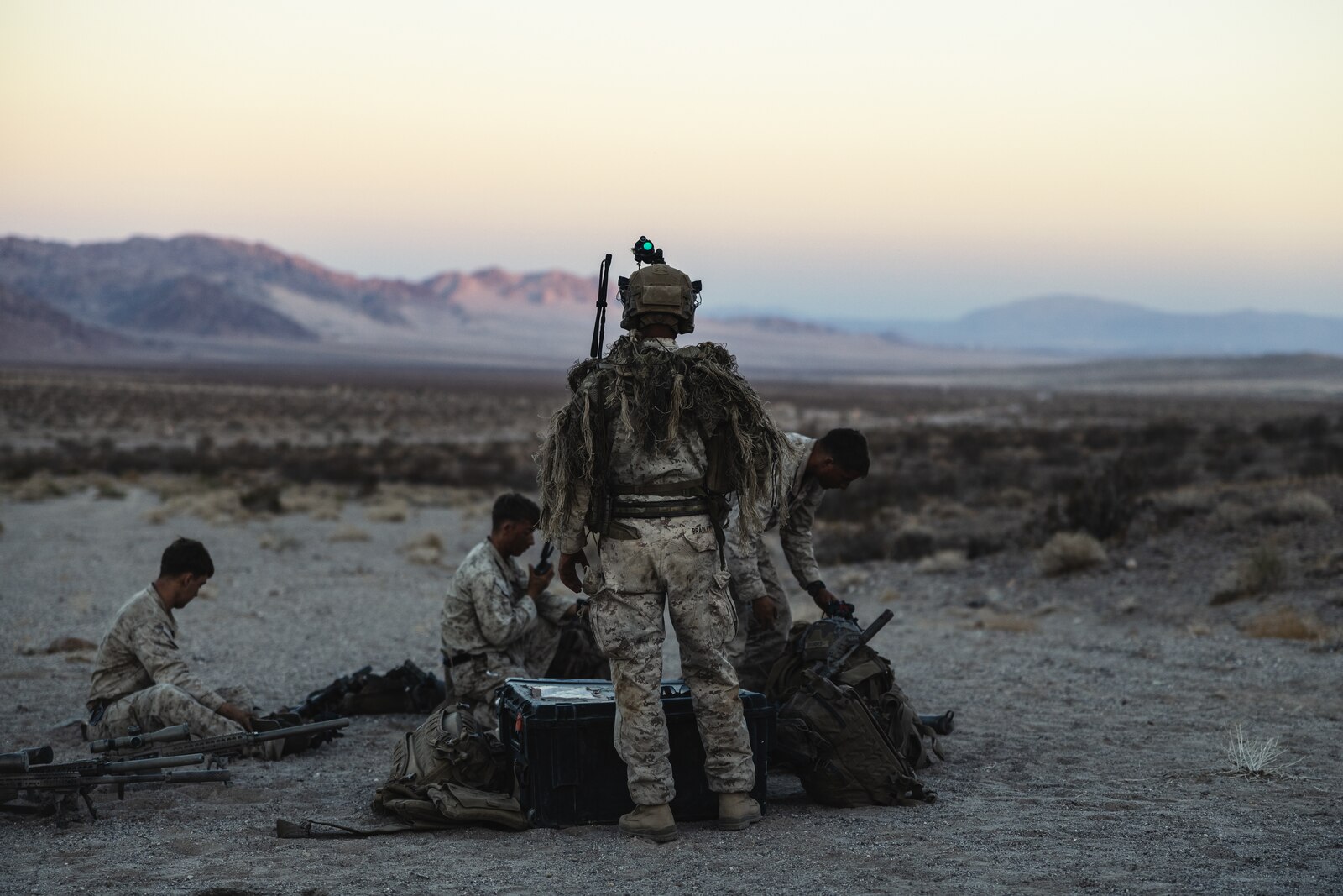 U.S. Marine scout snipers finish preparing for the non-live fire portion of the Ground Reconnaissance Course.