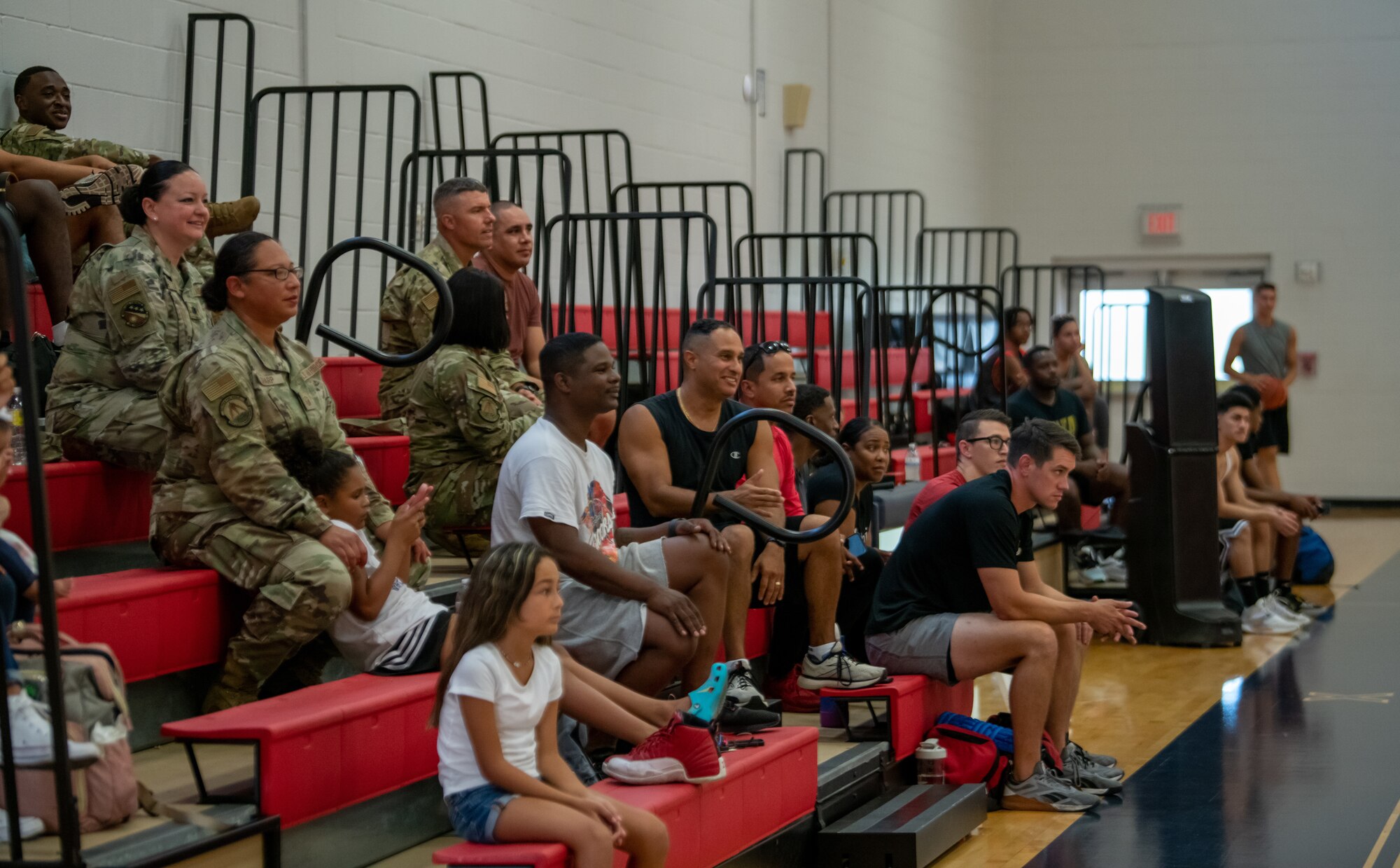 A crowd watches a basketball