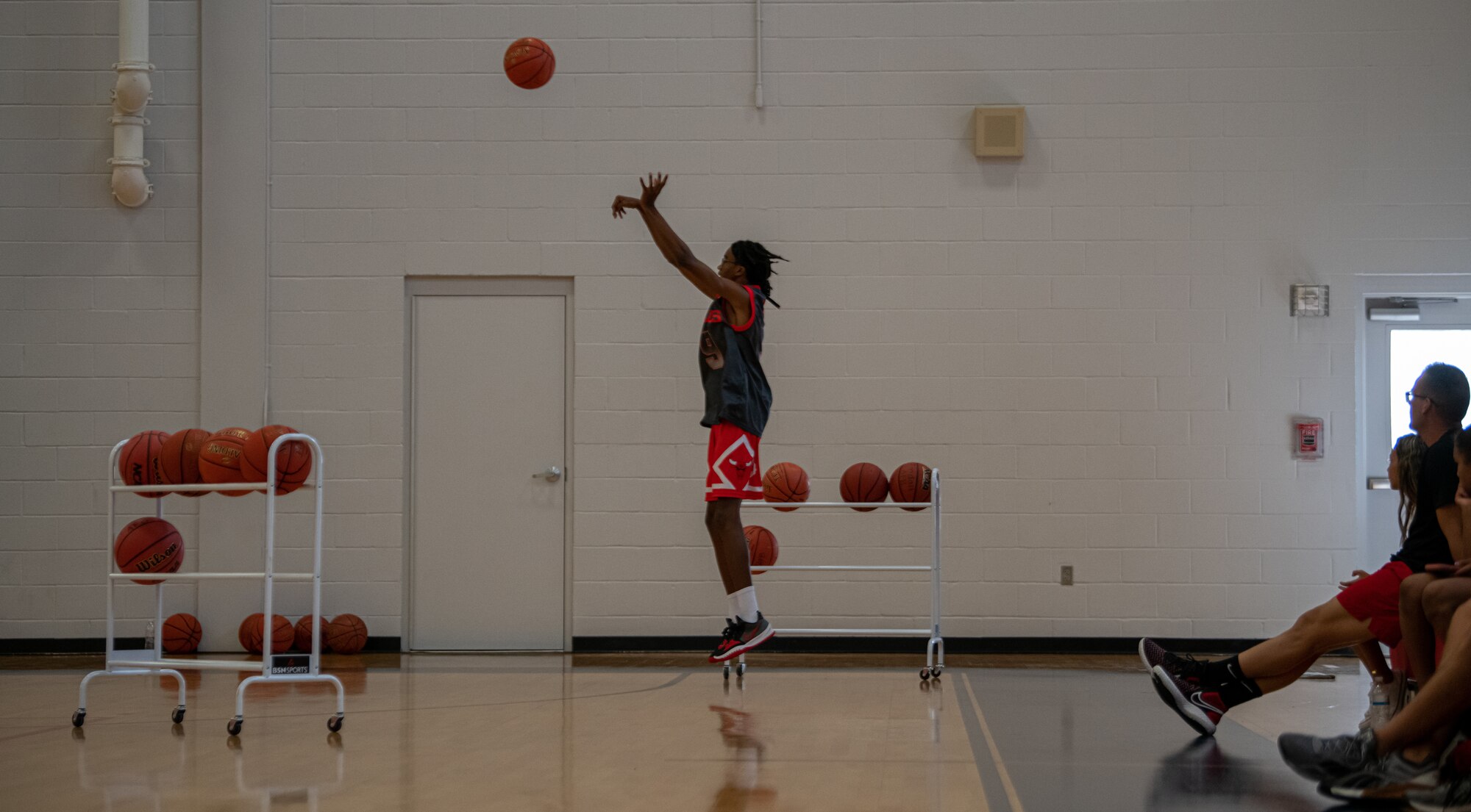 A person shoots a basketball