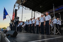 The Singing Sergeants, the official chorus of The United States Air Force Band, sing the National Anthem during a tour at Mt. Vernon, Ill., July 4, 2022. Formed initially as a men's chorus in 1945 from the rank and file of The U.S. Army Air Forces Band, the Singing Sergeants became the first premier military chorus to enlist women in 1973, diversifying their mission and increasing their scope of musical versatility. (U.S. Air Force photo by Airman Bill Guilliam)