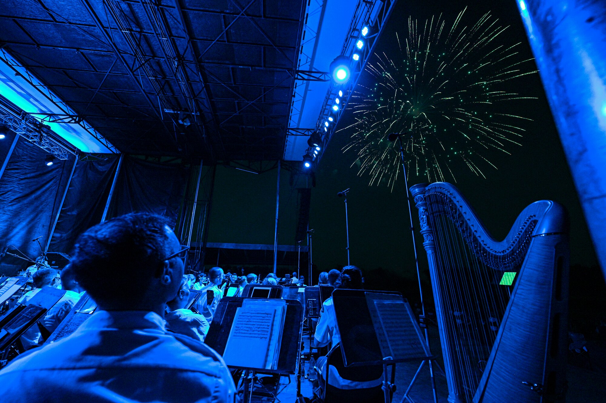 The U.S. Air Force Concert Band and the Singing Sergeants watch a fireworks show after a performance at an Independence Day fair at Mt. Vernon, Ill., July 4, 2022. 
The members of The Band and the United States Air Force Honor Guard share a common mission of representing the values of the Air Force and helping to foster a community across our nation and with our international allies. (U.S. Air Force photo by Airman Bill Guilliam)