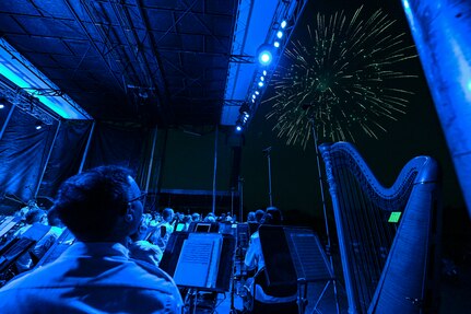 The U.S. Air Force Concert Band and the Singing Sergeants watch a fireworks show after a performance at an Independence Day fair at Mt. Vernon, Ill., July 4, 2022. 
The members of The Band and the United States Air Force Honor Guard share a common mission of representing the values of the Air Force and helping to foster a community across our nation and with our international allies. (U.S. Air Force photo by Airman Bill Guilliam)