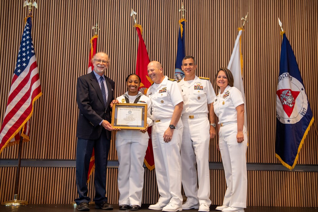 Master-At-Arms 2nd Class Breanna Byrd, assigned to Naval Station Everett, poses for a photo with Rear Adm. Carlos Sardiello, commander, Carrier Strike Group 1, and other command members during the Seattle Navy League Sea Services Awards Luncheon at Fleet Week, Aug. 4, 2022. Fleet Week Seattle is a time-honored celebration of the sea services and provides an opportunity for the citizens of Washington to meet Sailors, Marines and Coast Guardsmen, as well as witness firsthand the latest capabilities of today's maritime services. (U.S. Navy photo by Mass Communication Specialist 2nd Class Victoria Galbraith)
