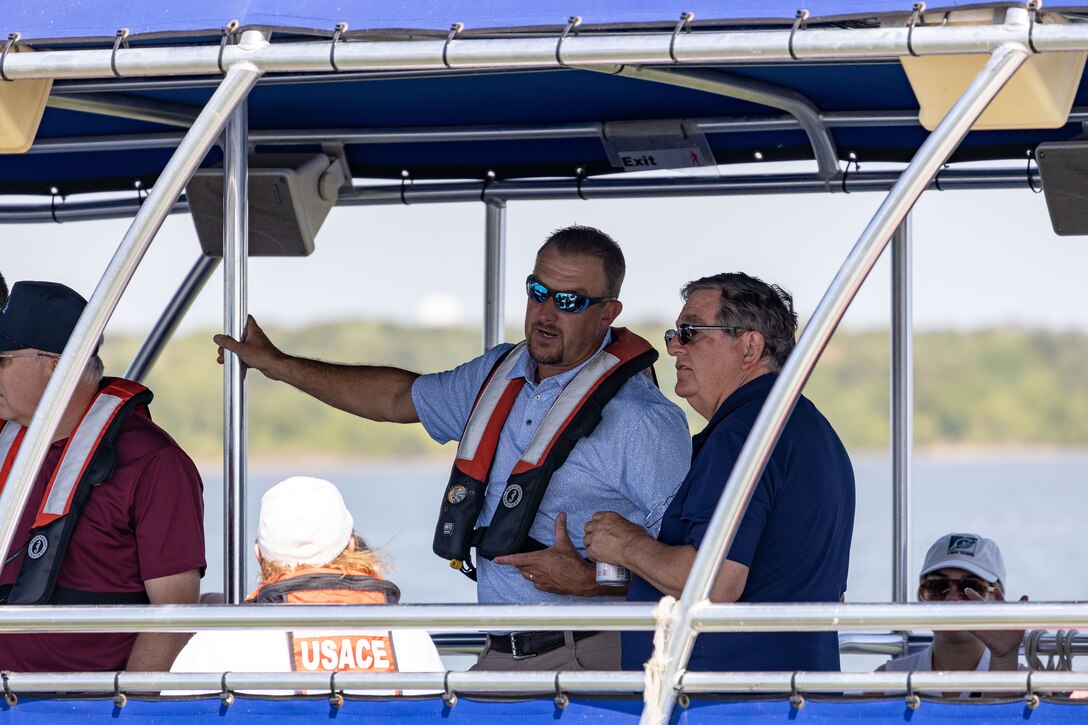 a group of people on a boat on a lake