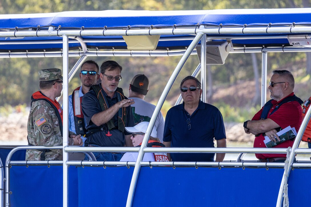 a group of people on a boat on a lake