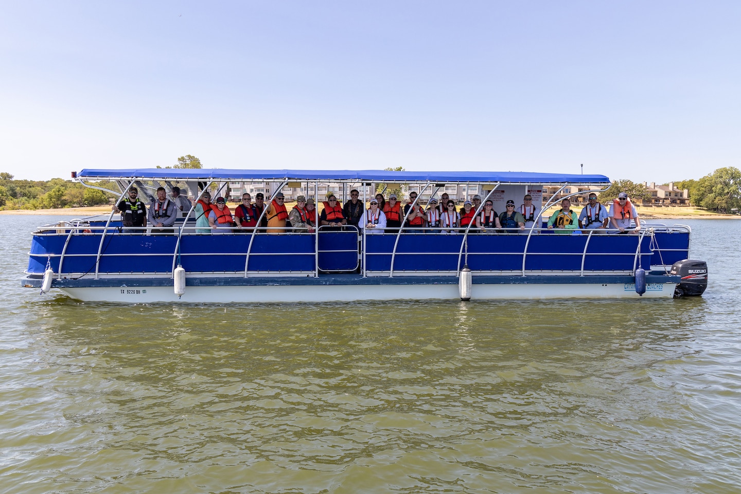 a group of people on a boat on a lake