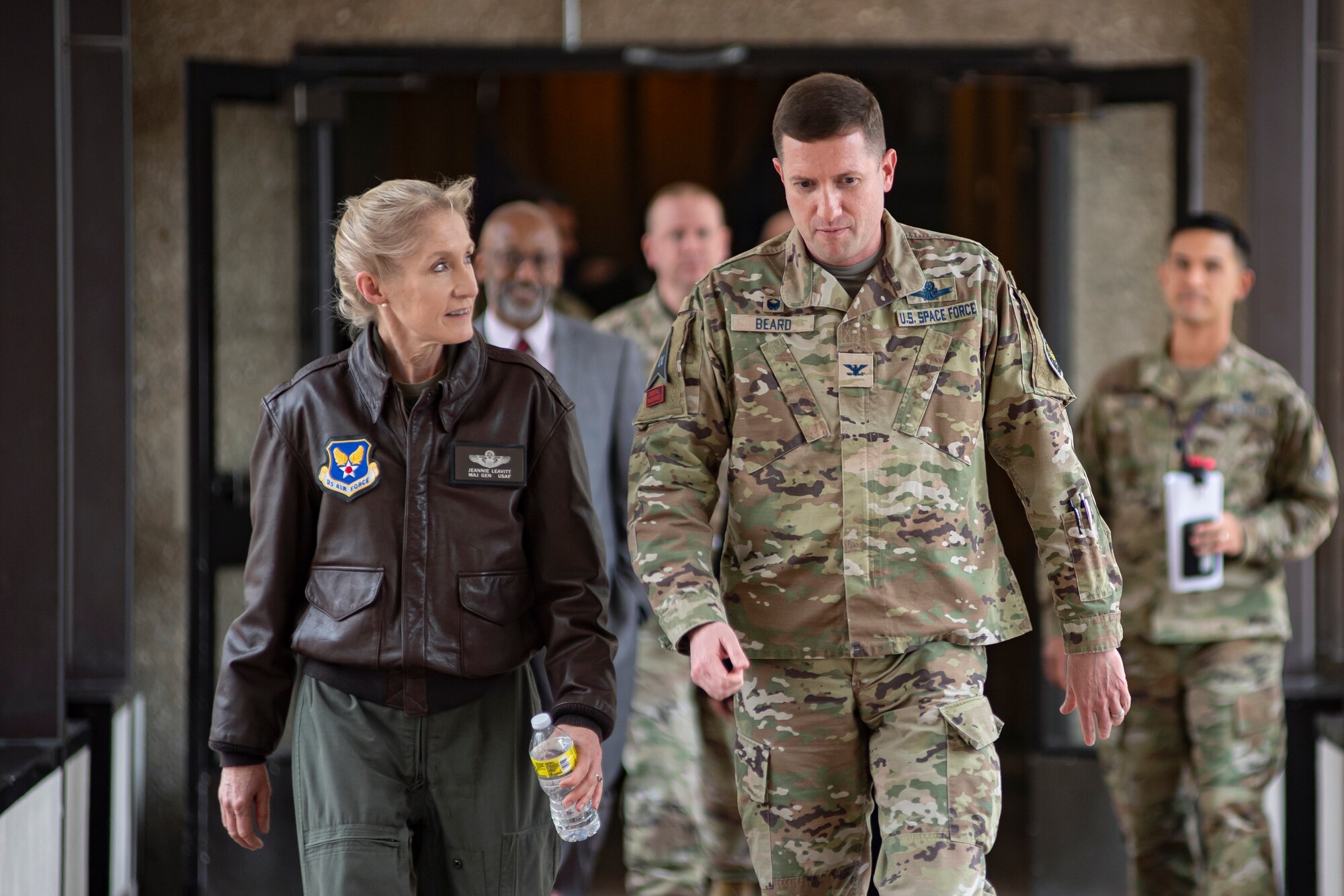 Personnel walk through Delta 9
