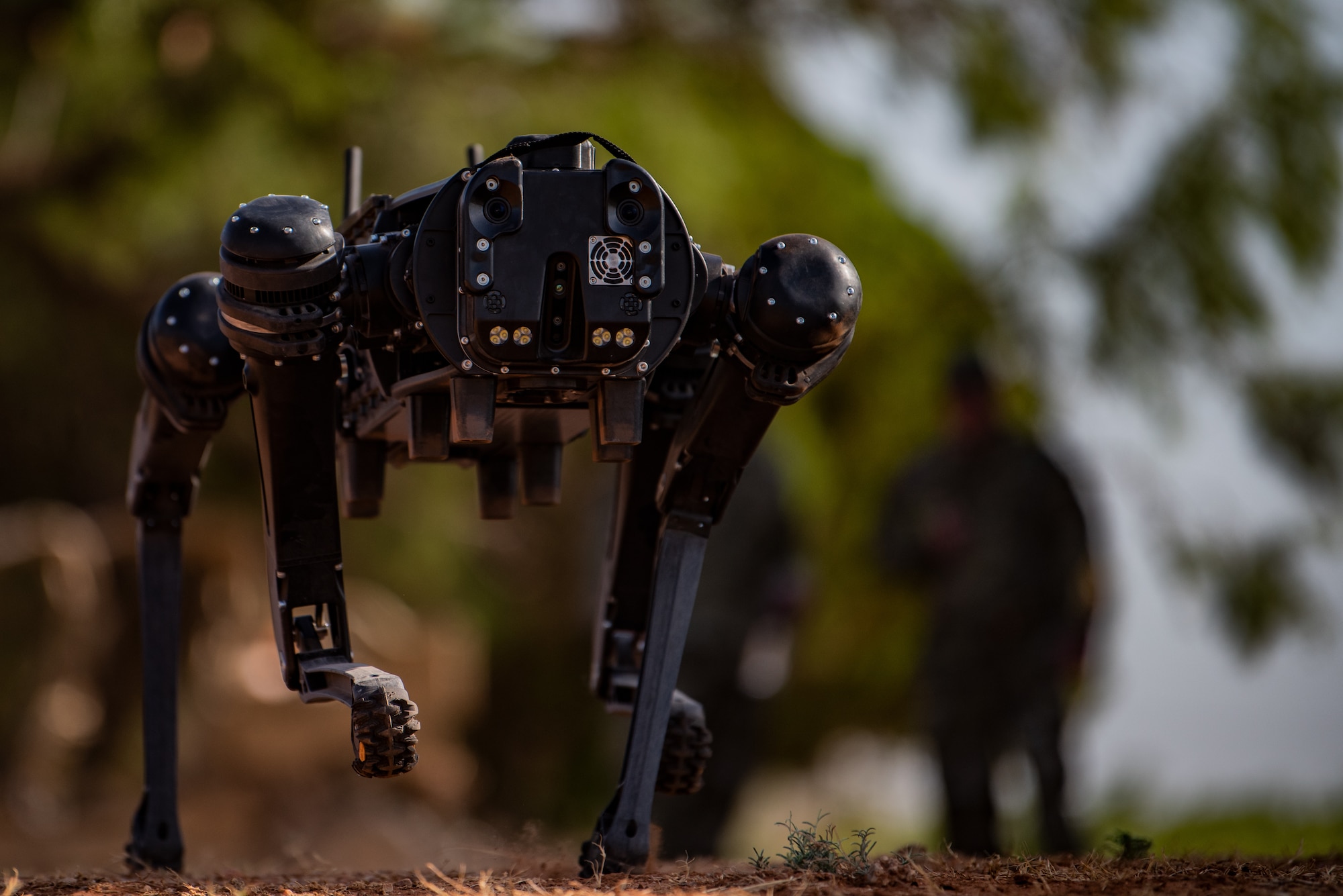 A robot dog runs during initial training exercise at Dyess Air Force Base, Texas, Aug. 5, 2022. This newly procured Ghost Robotics model of robot dog has a top speed of six miles per hour. (U.S. Air Force photo by Airman 1st Class Ryan Hayman)