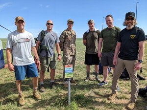 Six men stand and pose for a photo