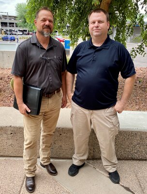 PHOENIX – The Los Angeles District Phoenix Office security specialists Shane Bush and Paul Drew pose for team photo August 3, near the Phoenix Office Area. Security programs are a large part of the Corps’ protection process. Drew has recently served two years as a security investigator. He will be moving to the Institute for Water Resources, where he will continue serving the Corps as a security professional. (Photo by Robert DeDeaux, Los Angeles District PAO)