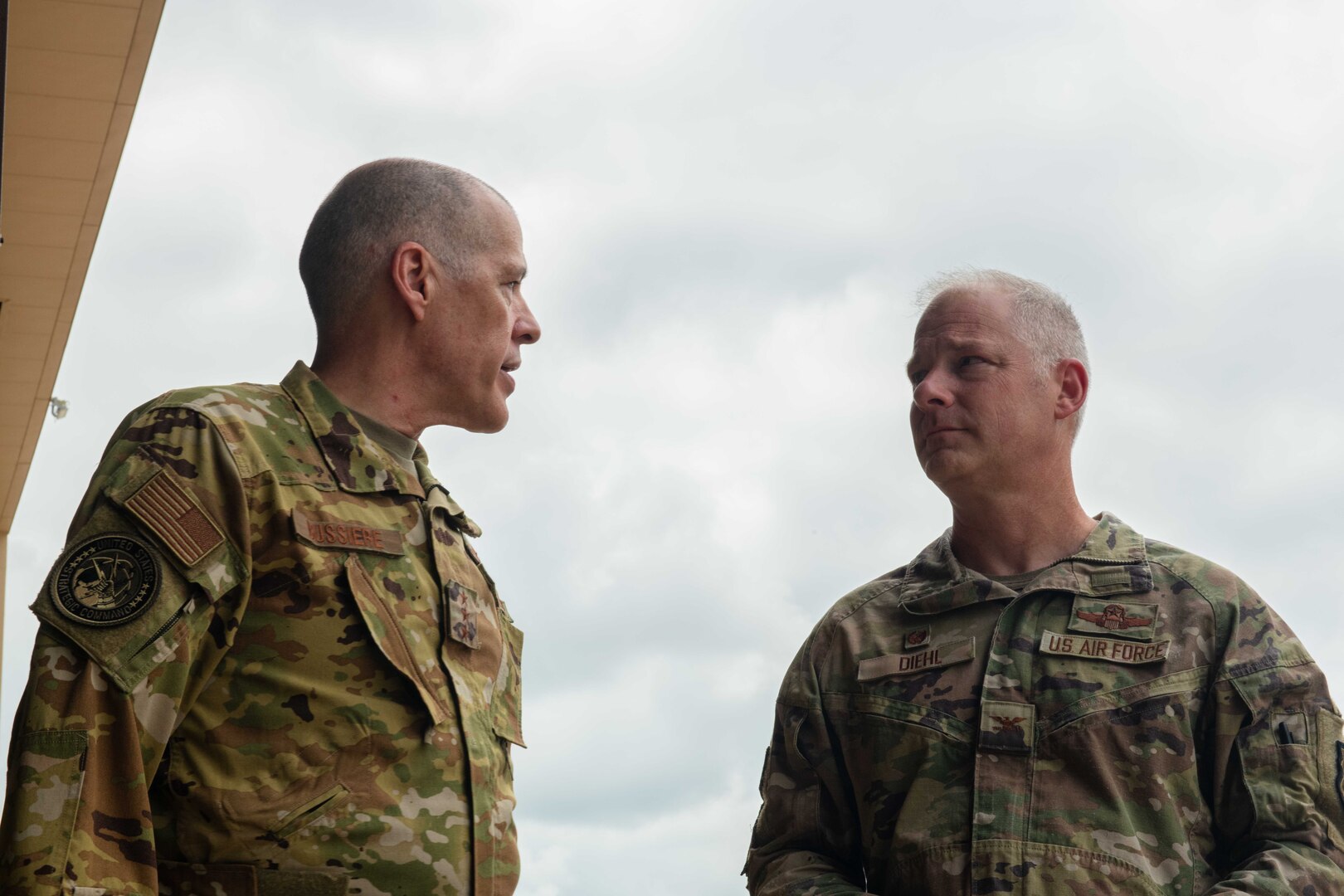 U.S. Air Force Lt. Gen. Thomas Bussiere, United States Strategic Command deputy commander, and U.S. Marine Corps Master Gunnery Sgt. Charles Baker, United States Strategic Command, Commandant, participate in a tour of the B-2 Spirit and talk to various Airmen across the 509th Bomb Wing Aug. 4, 2022, on Whiteman Air Force Base, Mo. Bussiere and Baker visited Whiteman Air Force Base to present the 509th Operations Support Squadron with, and congratulate them for winning, the 2021 Omaha Trophy. (U.S. Air Force photo by Airman 1st Class Bryson Britt)