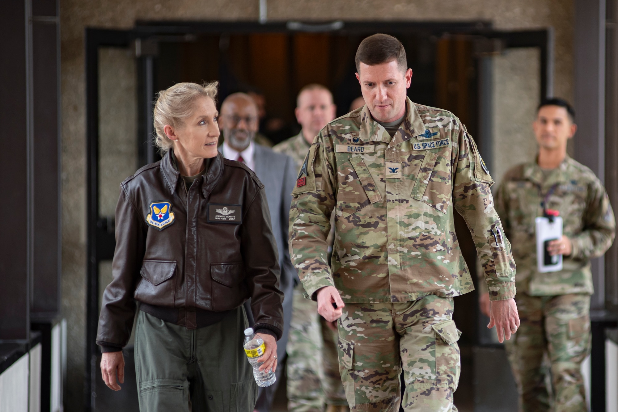 Personnel walk through Delta 9