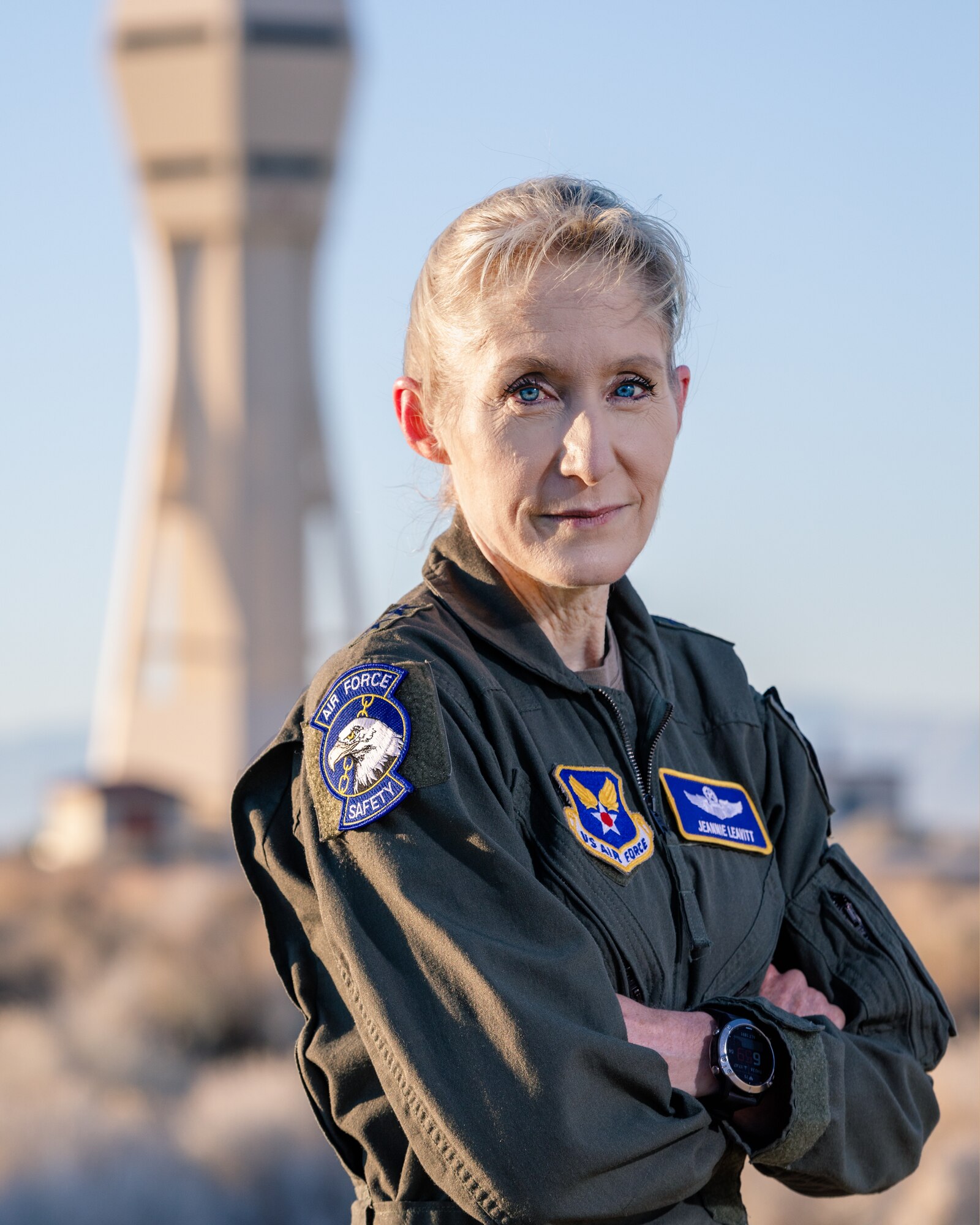 Maj. Gen. Leavitt pose in front of Air Traffic Control tower