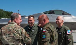 U.S. Air Force Gen. James Hecker, U.S. Air Forces in Europe and Air Forces Africa commander, visited the 32nd Tactical Air Base in Łask, Poland, to welcome 12 U.S. Air Force F-22 Raptors forward deploying from the 90th Fighter Squadron at Joint Base Elmendorf-Richardson, Alaska, Aug. 5, 2022. The Raptor is a critical component of the global strike Task Force, and is designed to project air dominance, rapidly and at great distances to defeat threats.  (U.S. Air Force photo by Staff Sergeant Danielle Suhklull)