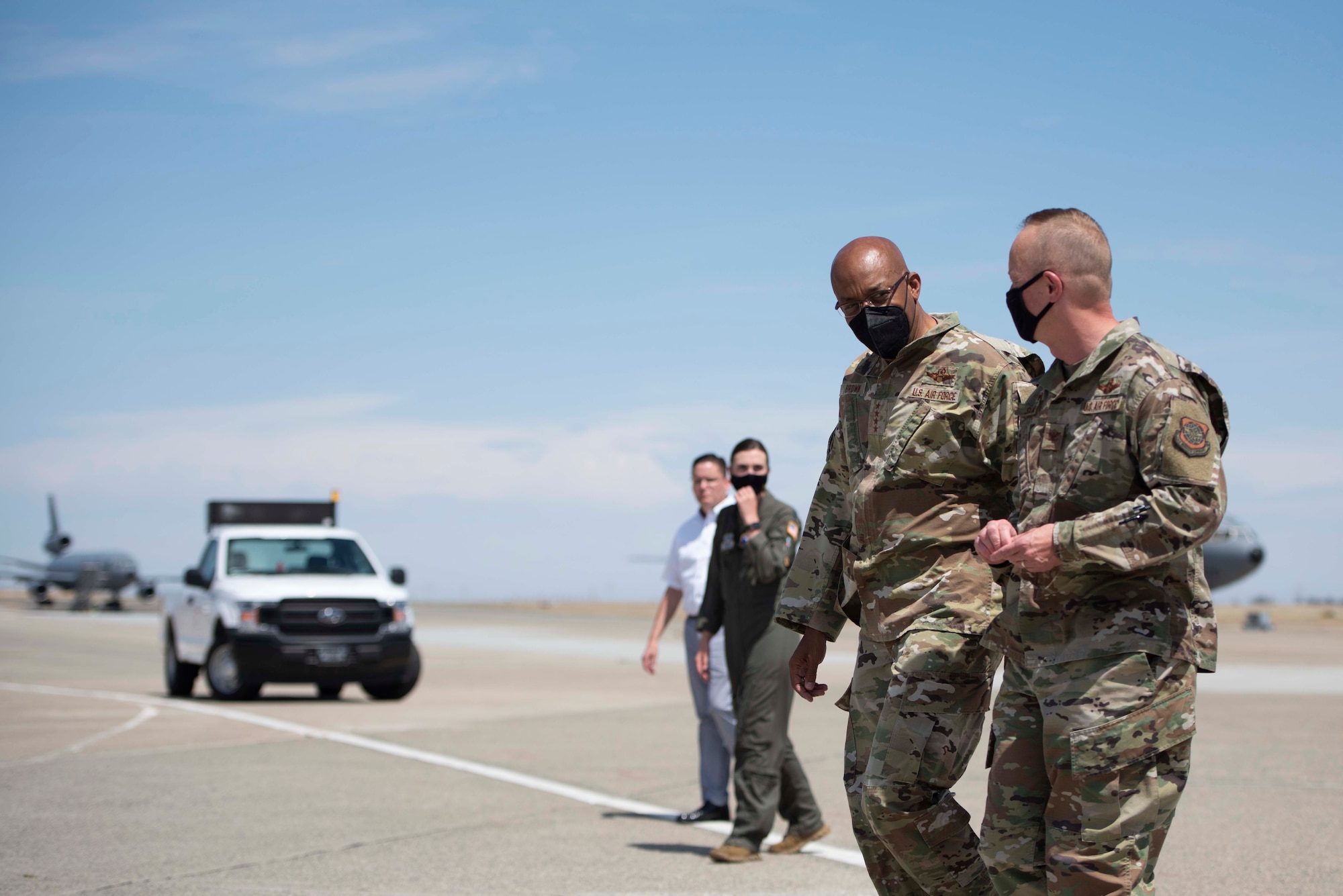 Airmen walk on the flight-line