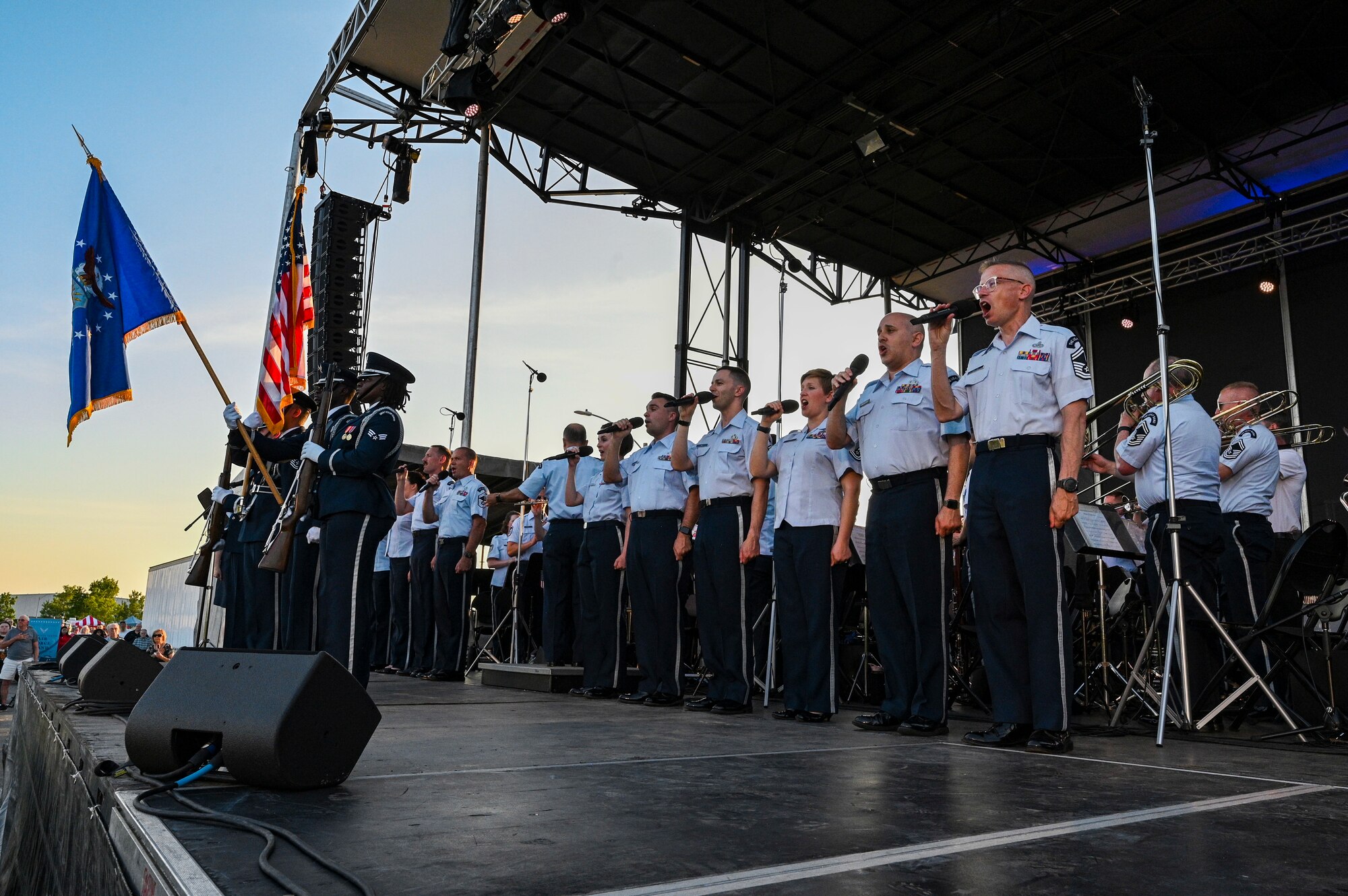 The Singing Sergeants, the official chorus of The United States Air Force Band, sing the National Anthem during a tour at Mt. Vernon, Ill., July 4, 2022. Formed initially as a men's chorus in 1945 from the rank and file of The U.S. Army Air Forces Band, the Singing Sergeants became the first premier military chorus to enlist women in 1973, diversifying their mission and increasing their scope of musical versatility. (U.S. Air Force photo by Airman Bill Guilliam)