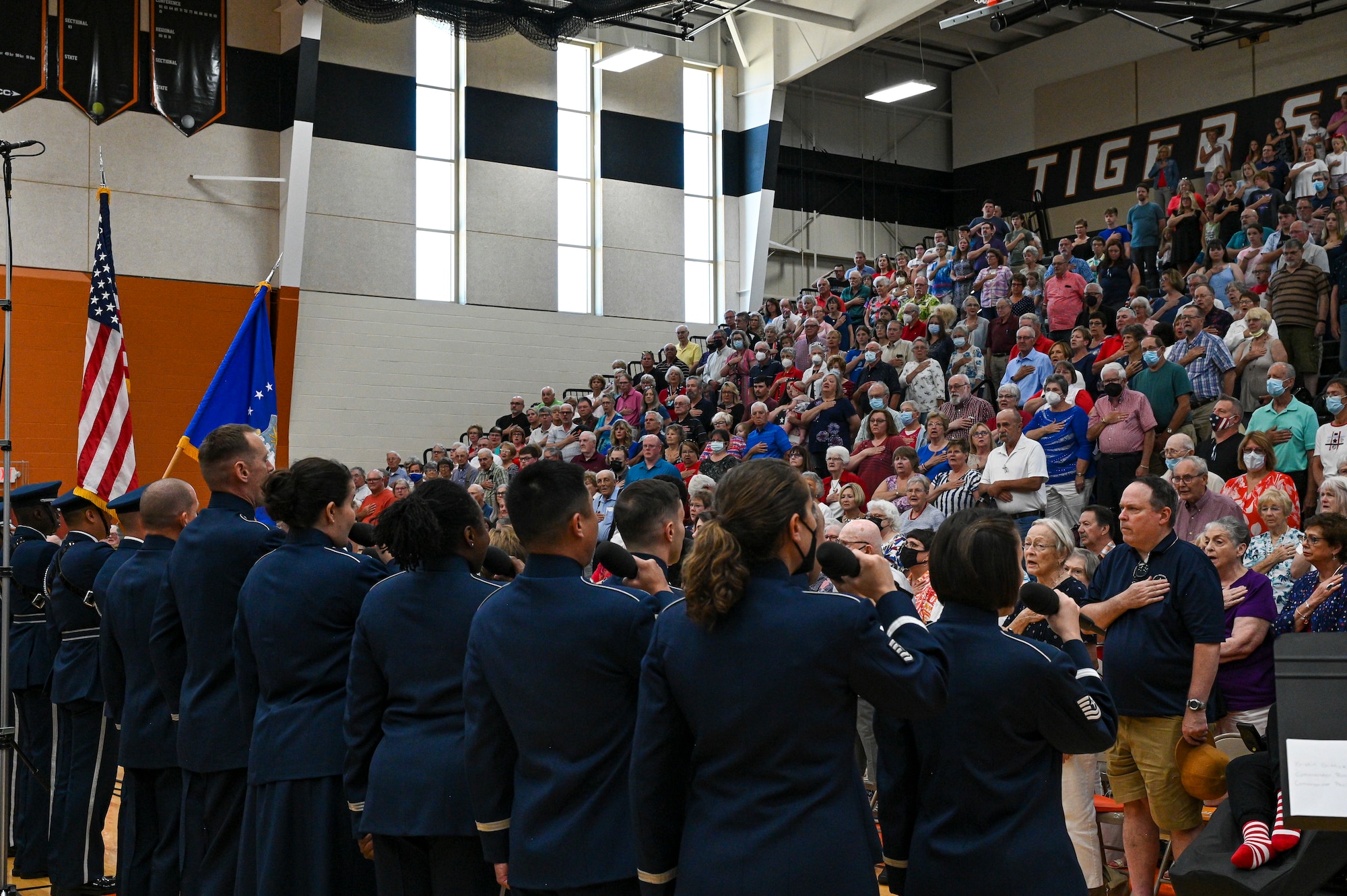 The Singing Sergeants, the official chorus of The United States Air Force Band, sing the national anthem during a tour at Paris, Ind., July 3, 2022. Featuring 24 active-duty musicians, the Singing Sergeants support military and civilian ceremonial and diplomatic functions, education outreach events, and concerts throughout metropolitan Washington, D.C., and the United States. (U.S. Air Force photo by Airman Bill Guilliam)