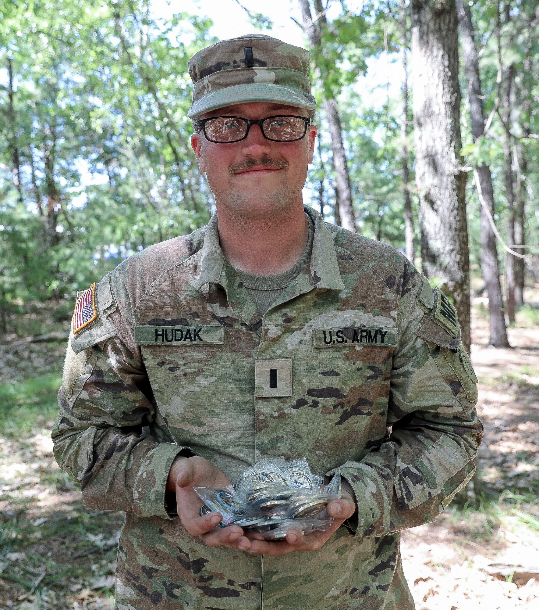 1st. Lt. Andrew Hudak of the 237th Military Police Company displays the 19 individual awards he earned at the NHNG Combat Marksmanship Match on July 30, 2022, at Fort Devens, Mass.