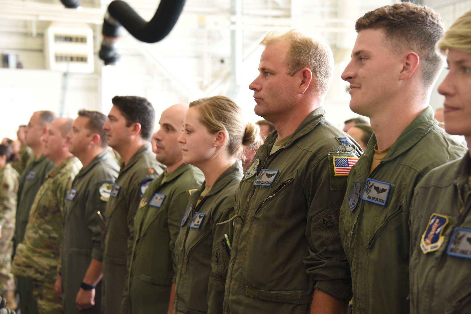 Airmen stand in formation for new commander
