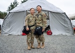 U.S. Air Force Senior Airman, 140th Medical Group, Colorado Air National Guard takes the vitals of her sister, U.S. Army Spc. Jessica Lee, 928th Area Support Medical Company, Colorado Army National Guard during an external evaluation in Camp Rilea, Oregon, July 12, 2022. These sisters serve together in the Colorado National Guard’s Chemical, Biological, Radiological, Nuclear and high-yield explosive Enhanced Response Force Package. ExEval is a certification process that every CERFP unit must go through every 24-36 months to prove that they are mission capable.