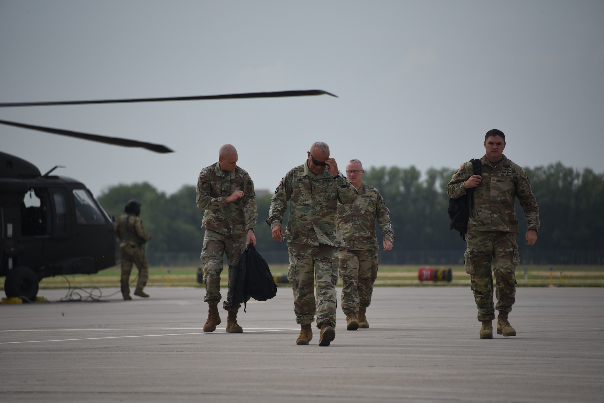 Pictured left to right, Brig. Gen. Shawn Ford, Maj. Gen. Benjamin Corell and Brig. Gen. William McClintock arrive at the Sioux Gateway Airport in a UH-60 Black Hawk