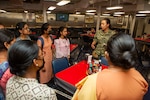 VISAKHAPATNAM, India (Aug. 2, 2022) – Lt. Kelly Chung, the legal officer aboard the Emory S. Land-class submarine tender USS Frank Cable (AS 40), speaks with students from St. Joseph’s College for Women during a tour of the ship while moored in Visakhapatnam, India, Aug. 2, 2022. Frank Cable is currently on patrol conducting expeditionary maintenance and logistics in the 7th Fleet area of operations in support of a free and open Indo-Pacific. (U.S. Navy photo by Mass Communication Specialist 2nd Class Kaitlyn E. Eads)