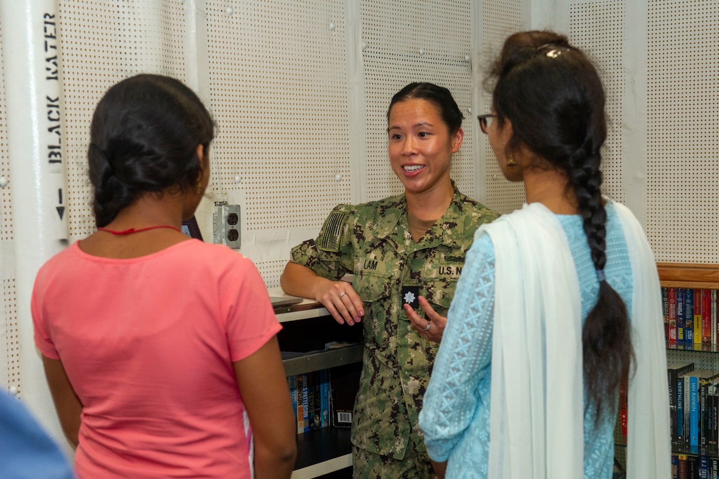 VISAKHAPATNAM, India (Aug. 2, 2022) – Cmdr. Doris Lam, the dental officer aboard the Emory S. Land-class submarine tender USS Frank Cable (AS 40), speaks with students from St. Joseph’s College for Women during a tour of the ship while moored in Visakhapatnam, India, Aug. 2, 2022. Frank Cable is currently on patrol conducting expeditionary maintenance and logistics in the 7th Fleet area of operations in support of a free and open Indo-Pacific. (U.S. Navy photo by Mass Communication Specialist 2nd Class Kaitlyn E. Eads)