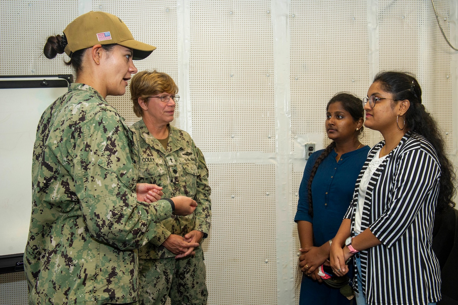 VISAKHAPATNAM, India (Aug. 2, 2022) – Lt. Jacqueline Benedict, the materials supply officer aboard the Emory S. Land-class submarine tender USS Frank Cable (AS 40), and Cmdr. Patricia Coley, the chaplain aboard Frank Cable, speak with students from St. Joseph’s College for Women during a tour of the ship while moored in Visakhapatnam, India, Aug. 2, 2022. Frank Cable is currently on patrol conducting expeditionary maintenance and logistics in the 7th Fleet area of operations in support of a free and open Indo-Pacific. (U.S. Navy photo by Mass Communication Specialist 2nd Class Kaitlyn E. Eads)