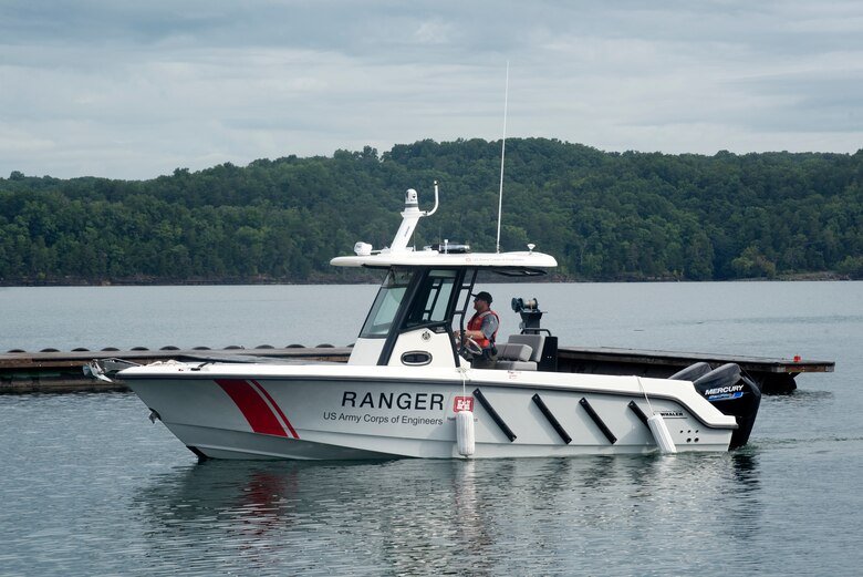 The U.S. Army Corps of Engineers Nashville District recently took possession of a Brunswick 250 Justice patrol boat equipped with twin 200 HP Mercury engines. The powerful vessel’s deep-V hull and pronounced chine make it easy to cut through heavy chop when responding or engaging the public about boating and water safety. This is the vessel at Marina at Rowena in Albany, Kentucky, Aug. 5, 2022. (USACE Photo by Lee Roberts)