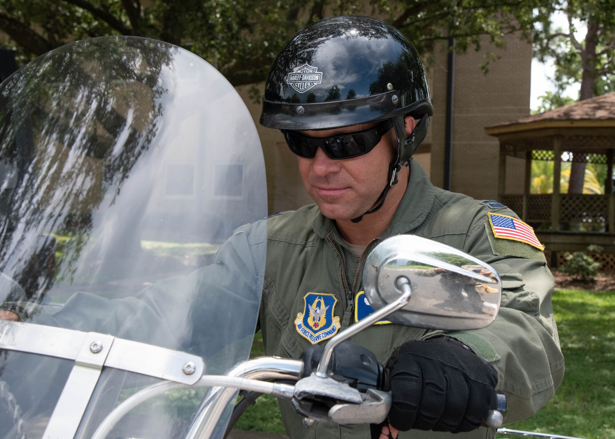 Capt. Allen grips the handlebars of his motorcycle