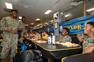 Sailors eating in mess decks