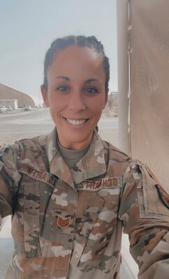 U.S. Air Force Reserve Master Sgt. Amory Schwartz stands smiling in her uniform.