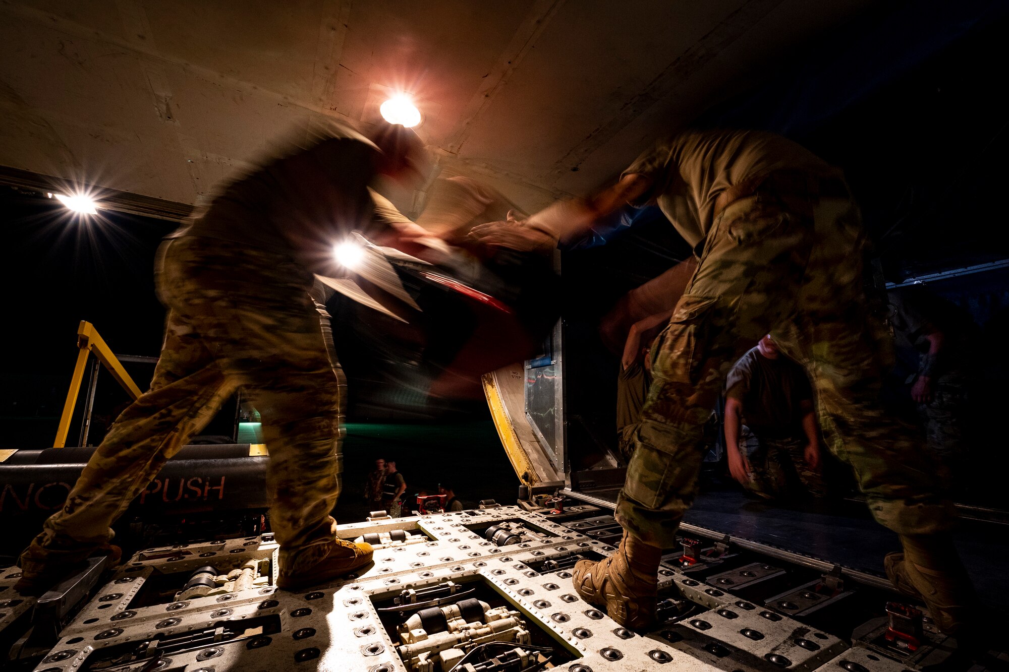 Shaw AFB Airmen load luggage onto an aircraft