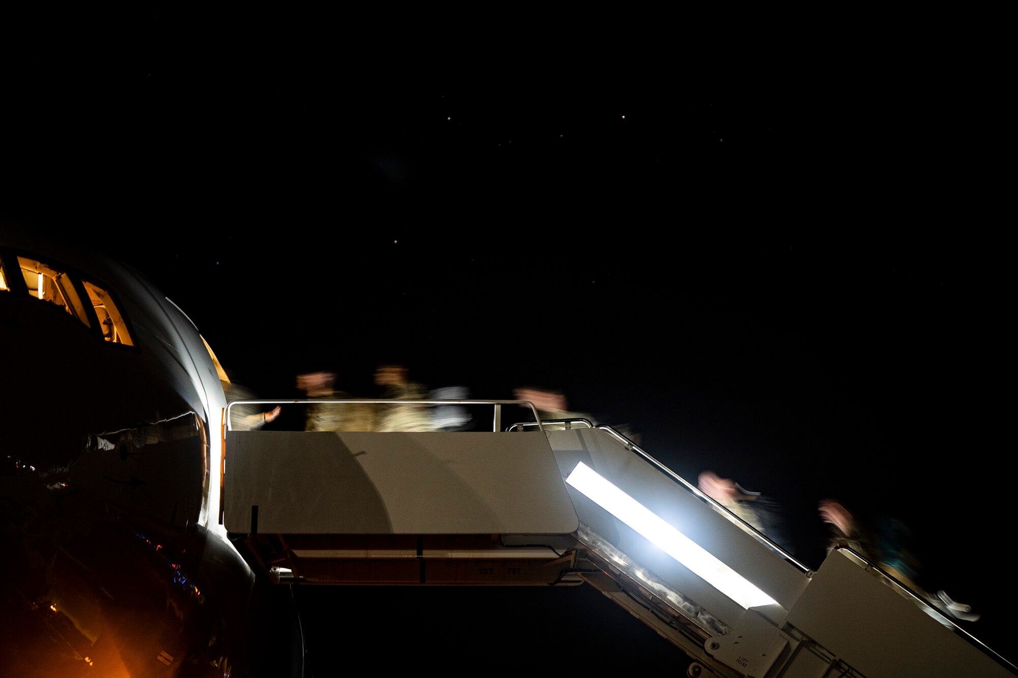 Shaw AFB Airmen step to an aircraft before deployment